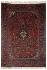 Alfombra persa clásica con un diseño central de medallón y fondo en tonos rojos y azules.