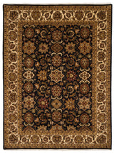 Vista completa de una alfombra tradicional con fondo oscuro y detalles florales intrincados en tonos marrón, beige y rojo.