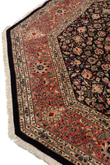 Borde de alfombra persa octagonal decorada con motivos florales y detalles geométricos.
