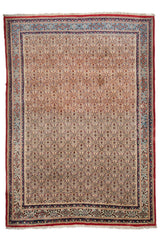 Alfombra octagonal con un detallado diseño floral central en tonos oscuros y bordes rojos y beige, con una guarda intricada de motivos florales.