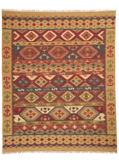 Vista superior completa de una alfombra kilim con patrones geométricos en tonos tierra, rojo, azul y mostaza.
