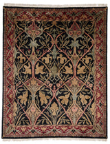 Vista completa de la alfombra con diseño floral en tonos oscuros y borde rojo.