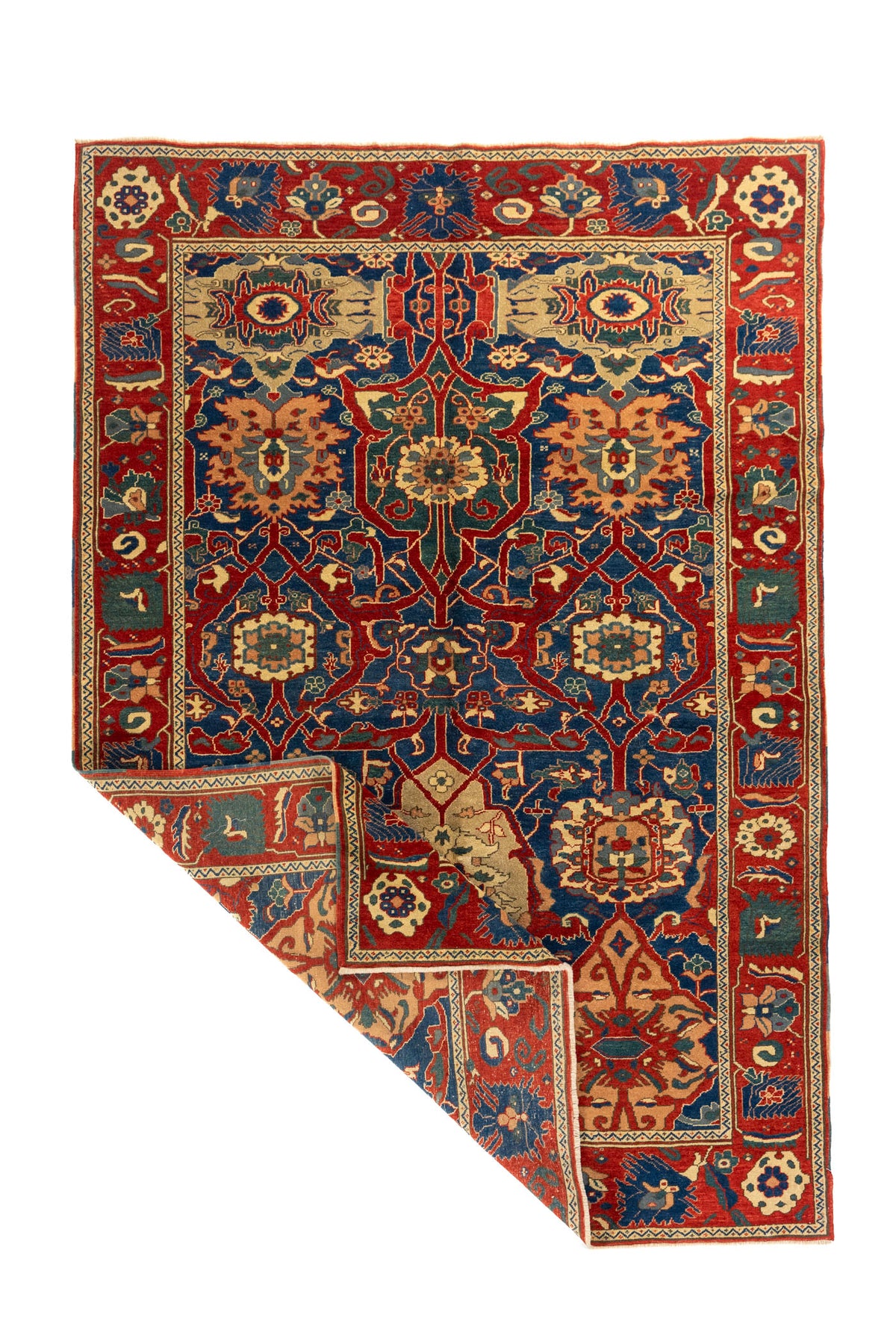 Alfombra oriental roja y azul con esquina doblada que muestra la flexibilidad y estructura del tejido