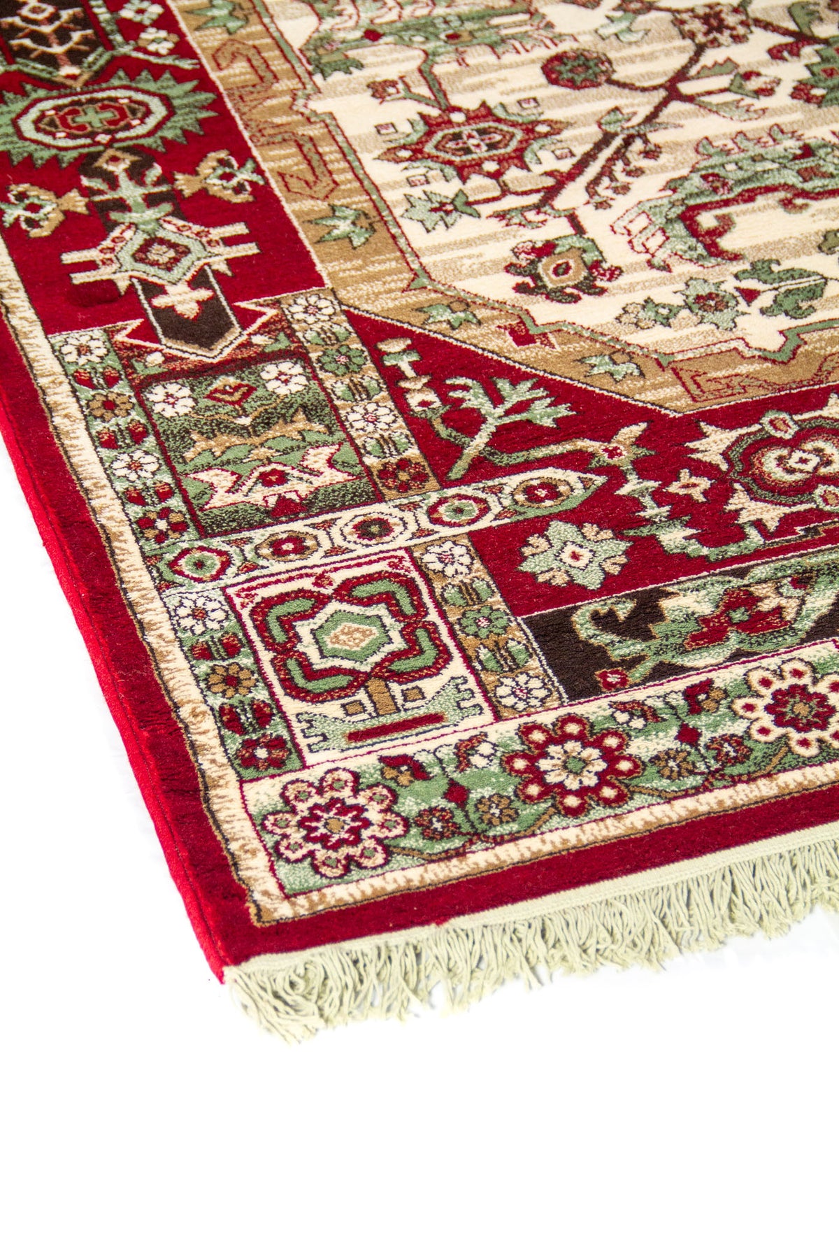 Acercamiento lateral de alfombra oriental con diseño geométrico detallado, guarda ornamental multicolor y terminación con flecos beige.