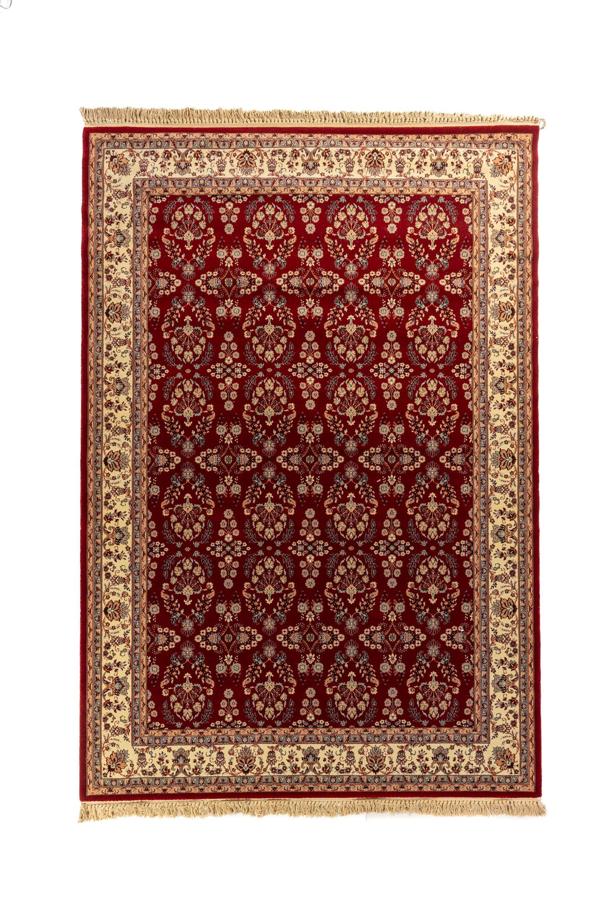 Alfombra clásica rectangular en color rojo intenso con diseño floral repetitivo, guarda beige ornamental y flecos en los extremos.