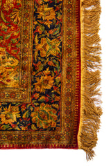 Detalle de guarda y flecos dorados de alfombra Ispahan Seda Fragmento floral