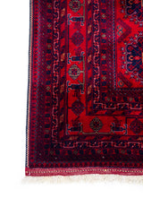 Detalle de guarda y flecos de Alfombra Persa Afgan en tonos rojo y negro 