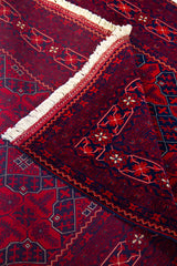 Detalle de textura, reverso y flecos de alfombra Persa Afgan con diseño tradicional