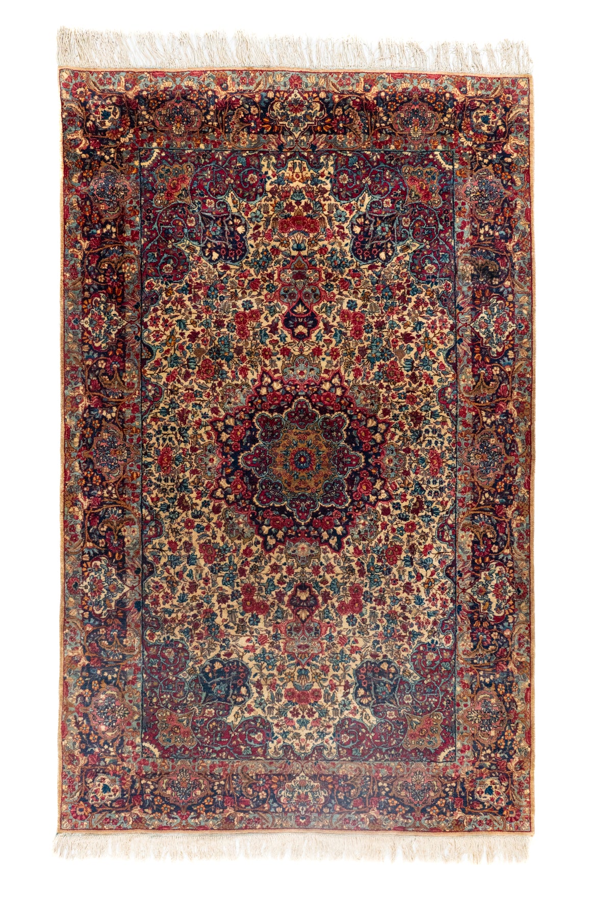 Alfombra persa Kirman Antik rectangular en tonos rojo y azul con diseño floral vintage