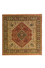 Alfombra oriental de diseño geométrico con medallón central rojo, detalles en beige y guarda decorativa en tonos marrón, azul y rojo.