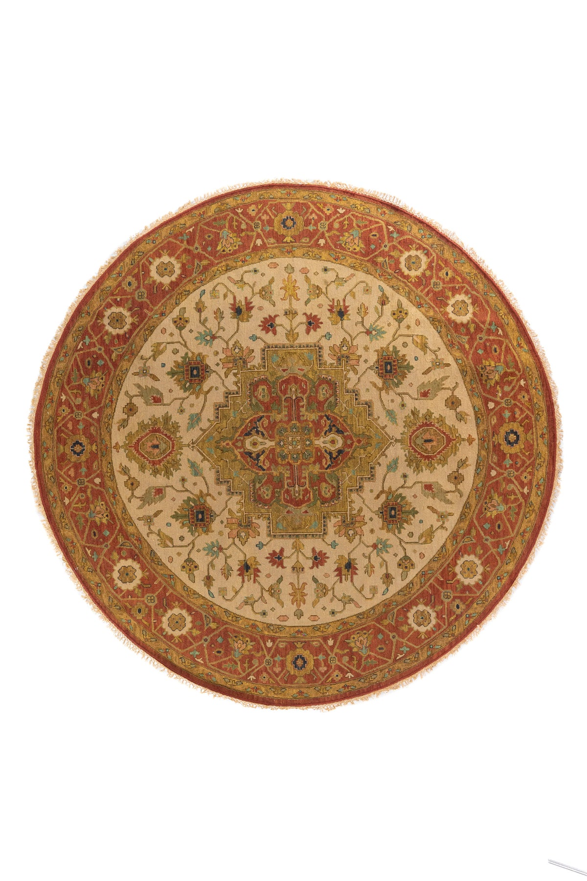 Alfombra redonda oriental en tonos beige, rojo y dorado con medallón central y motivos florales geométricos.