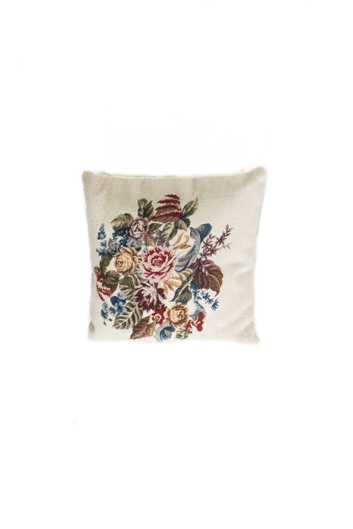Almohadón persa gobelino con fondo blanco y diseño floral multicolor