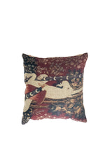 Almohadón persa gobelino unicornio en tonos rojo y con diseño floral