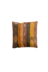 Almohadón persa kilim con diseño de rayas en tonos amarillo, marrón y verde.
