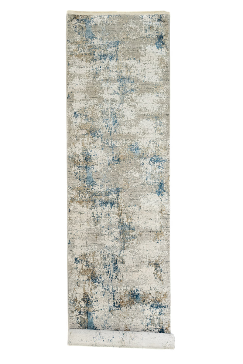 Alfombra parcialmente enrollada mostrando la parte inferior del diseño y detalles del reverso