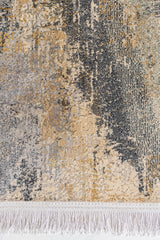 Detalle cercano del diseño frontal con textura en relieve, mezclando colores dorado, crema y gris oscuro.