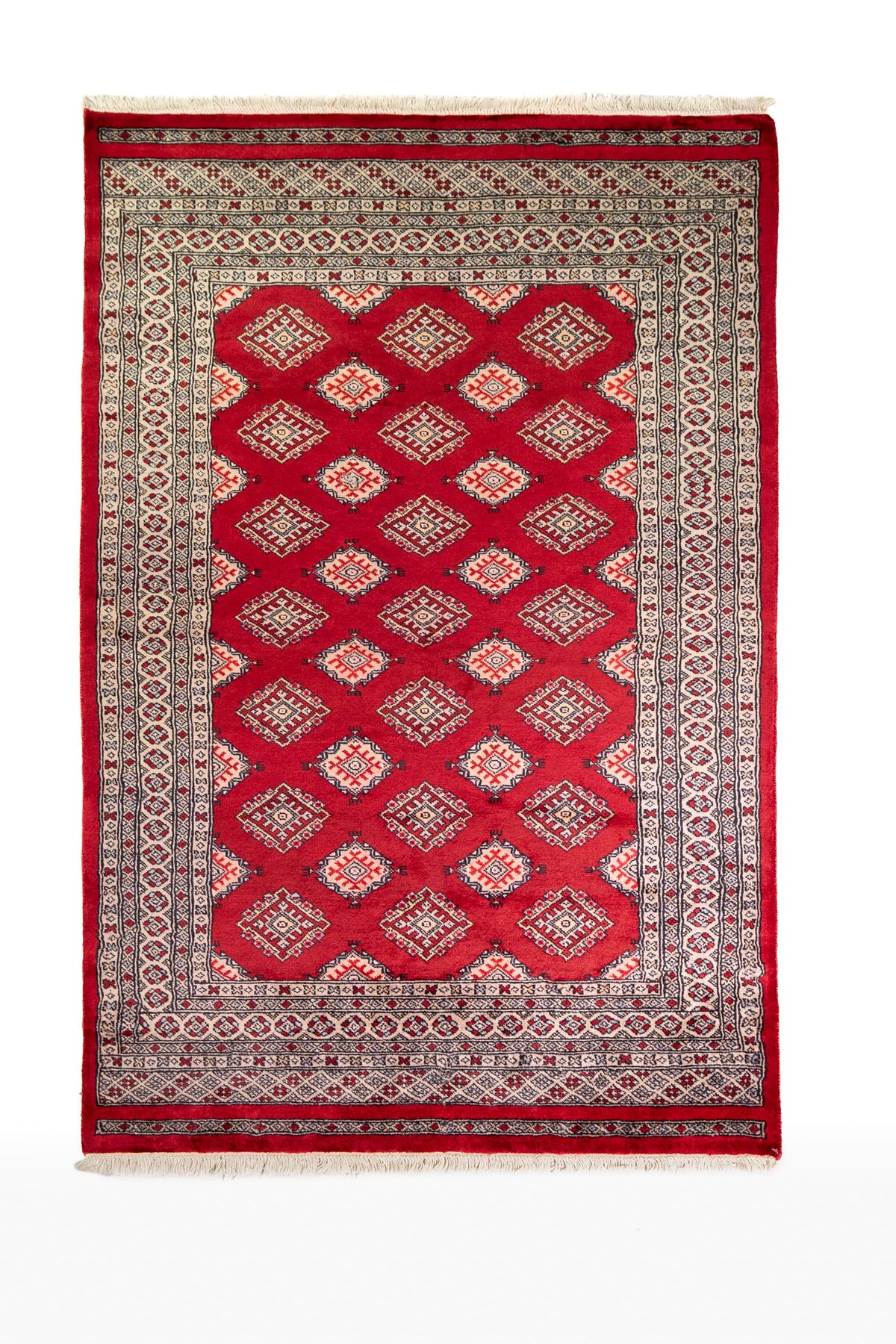 Alfombra Persa Yamouth rojo de 1.27 x 1.88 mts, vista completa vertical; el diseño muestra una retícula de rombos rojos enlazados con guardas geométricas de alto contraste