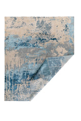 Alfombra Horizon Blue azul con esquina doblada y diseño abstracto moderno