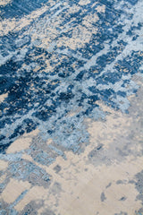 Detalle de textura de alfombra abstracta azul, celeste y beige