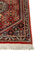 Alfombra Persa Horazan naranja y azul de 0.75 x 1.10 mts, detalle de guarda, trama visual y terminación de borde