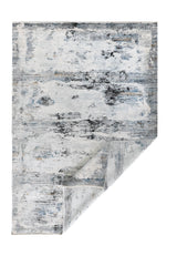 Alfombra Marble Grey rectangular con esquina doblada y diseño abstracto en tonos grises