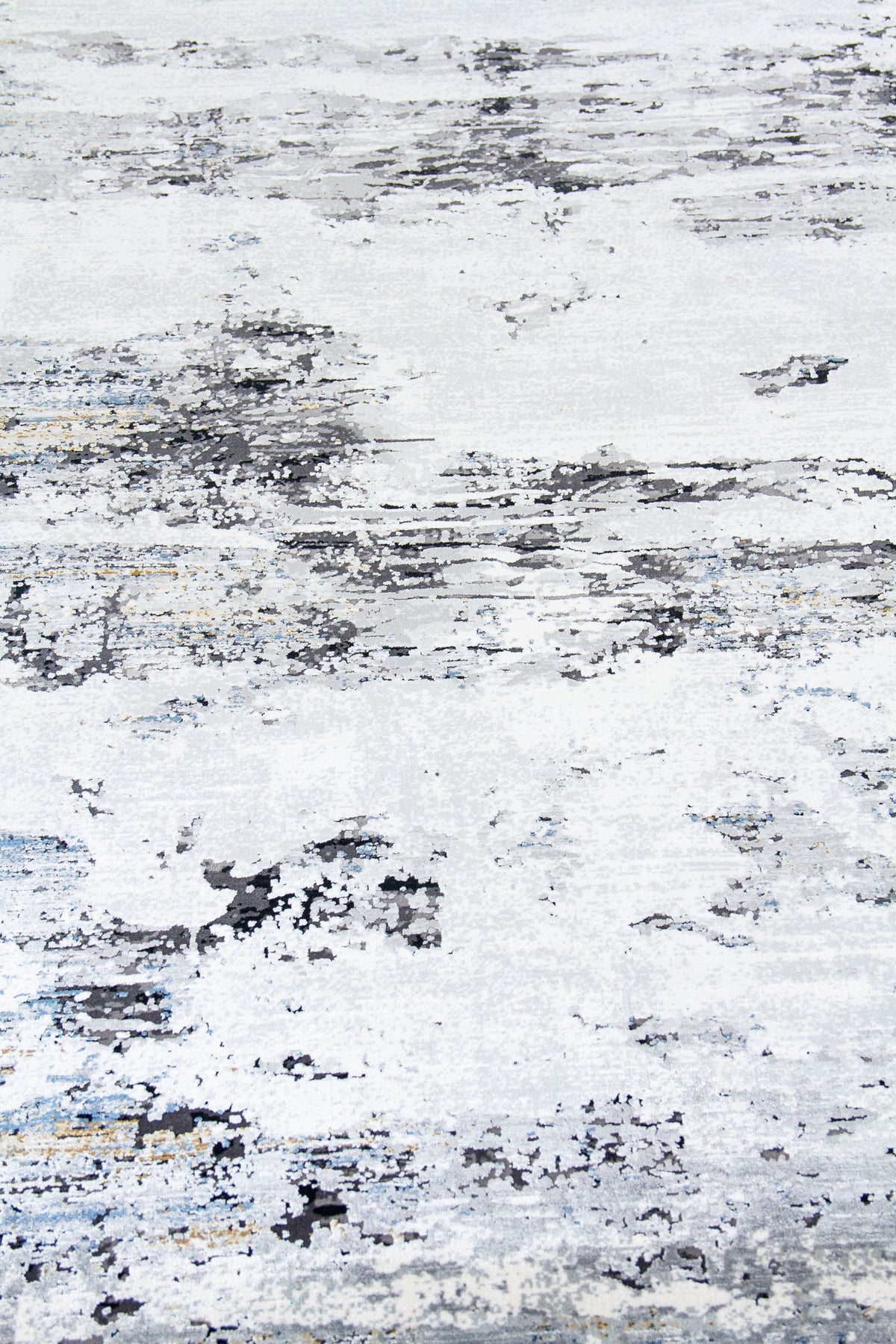 Detalle de textura de alfombra gris y blanca con manchas abstractas desgastadas