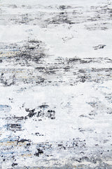 Detalle de textura de alfombra gris y blanca con manchas abstractas desgastadas