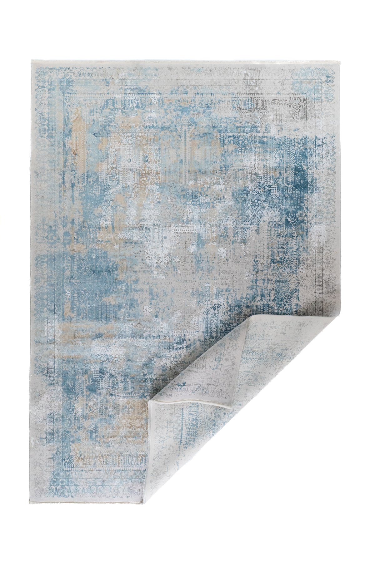 Alfombra Nordic Blue rectangular con esquina doblada y diseño abstracto en tonos azul y gris