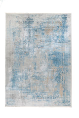 Alfombra rectangular Palace Blue en tonos celeste y gris con diseño abstracto desgastado