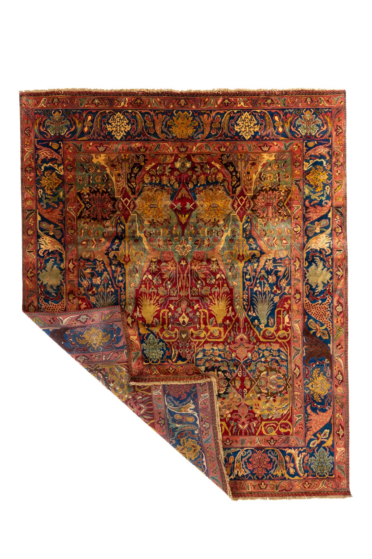 Alfombra clásica de gran formato con diseño ornamental en tonos rojo, azul, rosado, y composición central simétrica.