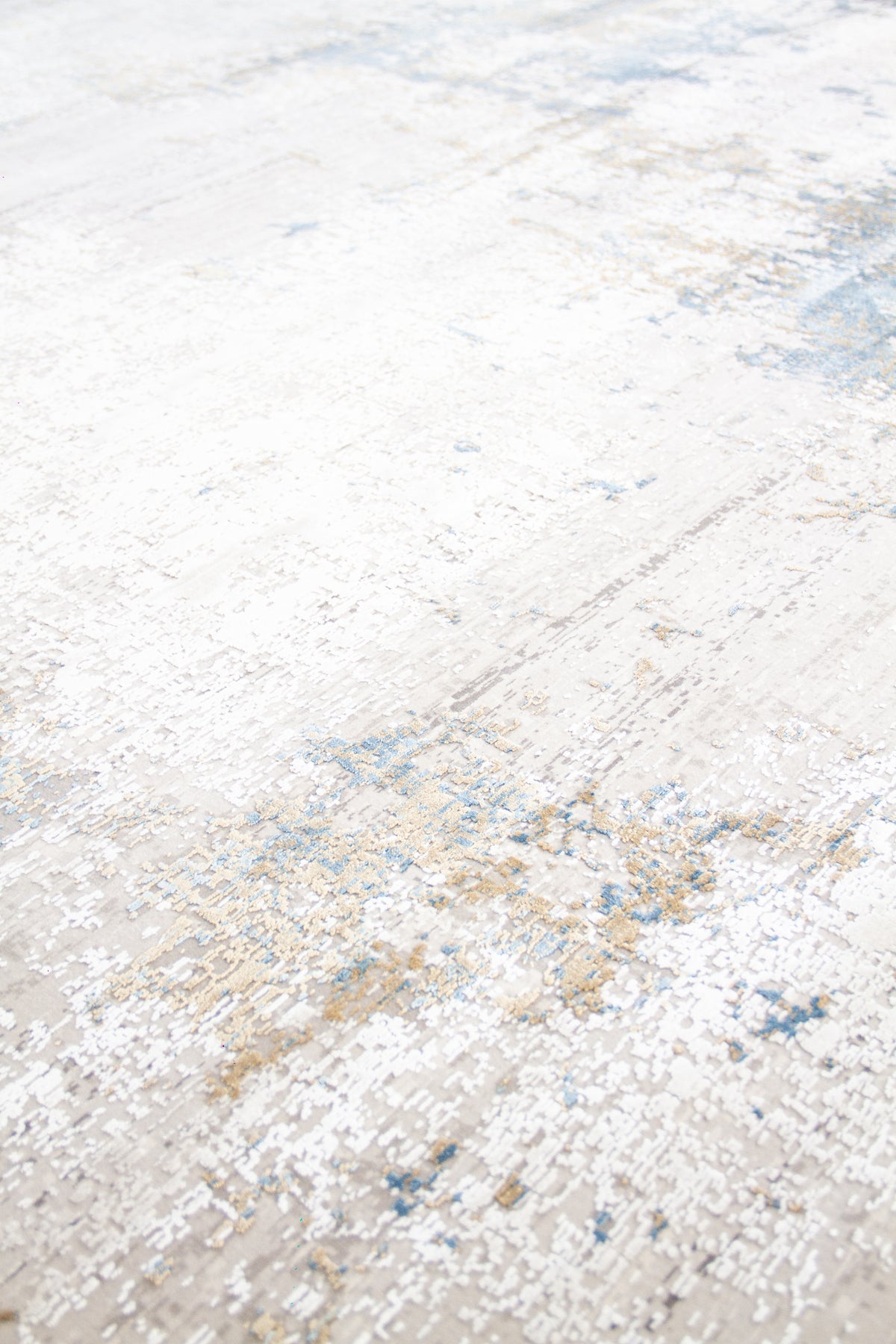 Detalle de textura de alfombra abstracta en tonos gris claro, blanco y celeste