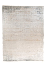Alfombra Shadow rectangular en tonos beige y gris con diseño abstracto desgastado
