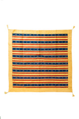 Textil decorativo Kayseri amarillo con rayas azules y rojas, diseño geométrico.