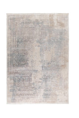 Alfombra rectangular Vintage Wash en tonos celeste y gris con diseño geométrico desgastado