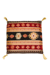 Almohadón turco rectangular con diseño geométrico tradicional en tonos rojos, negros y dorados.